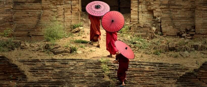 Three Monks walking on ancient temple.